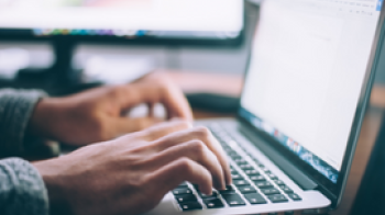 Person typing on a laptop